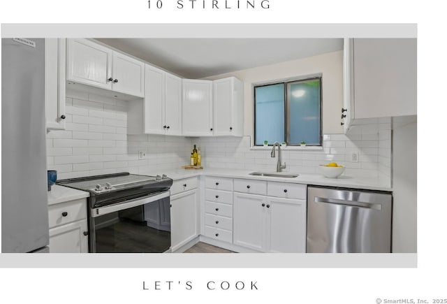 10 Stirling Ct, Middletown, CT 06457 - kitchen with stainless steel appliances, a sink, white cabinetry, and light countertops