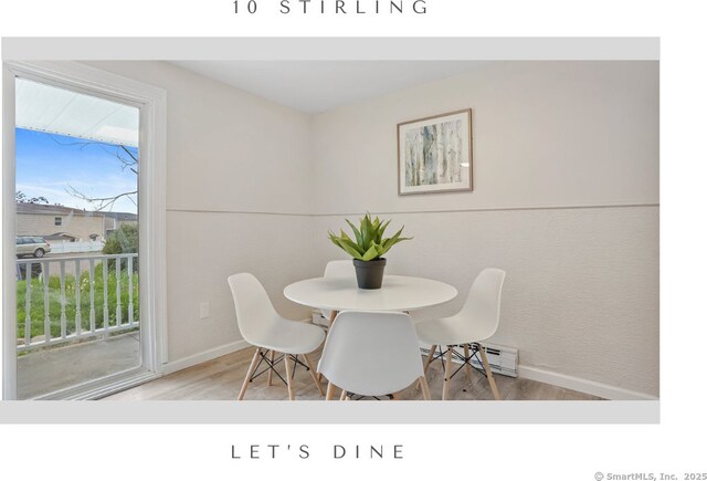 10 Stirling Ct, Middletown, CT 06457 - dining area with baseboards, wood finished floors, and a baseboard heating unit