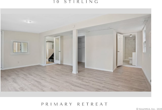 10 Stirling Ct, Middletown, CT 06457 - below grade area featuring stairway, wood finished floors, and baseboards