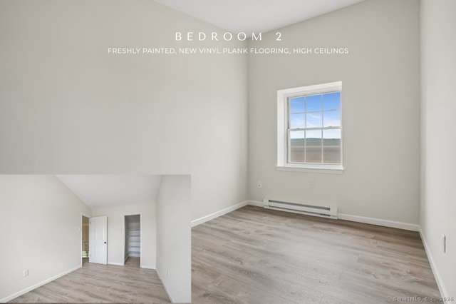 10 Stirling Ct, Middletown, CT 06457 - empty room with a baseboard heating unit, wood finished floors, and baseboards