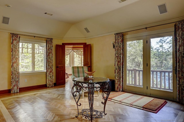 dining area featuring lofted ceiling and baseboards