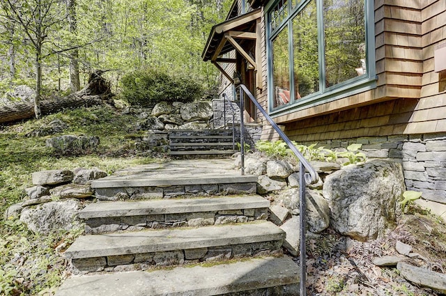 exterior space with stone siding