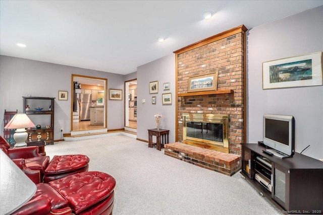 carpeted living area featuring a fireplace, recessed lighting, and baseboards
