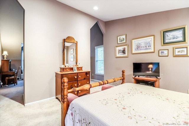 carpeted bedroom featuring baseboards and recessed lighting