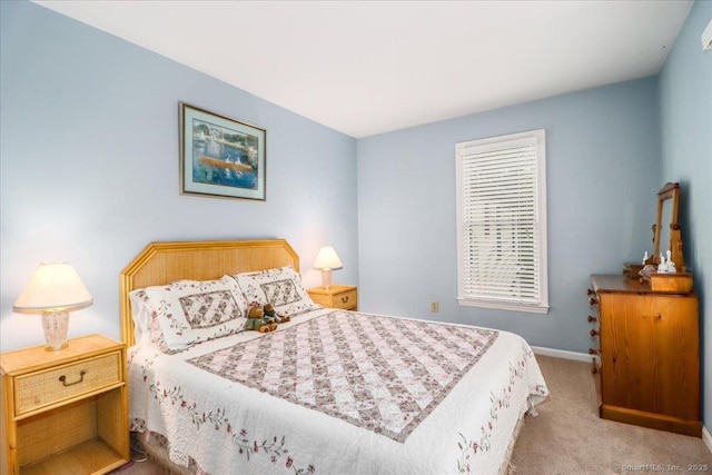 bedroom featuring carpet floors and baseboards