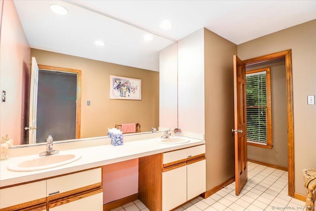 full bath with double vanity, tile patterned flooring, recessed lighting, and baseboards