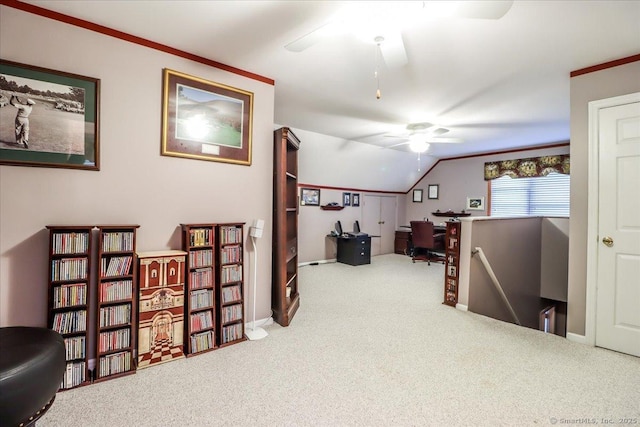 sitting room with carpet floors, a ceiling fan, a desk, vaulted ceiling, and baseboards