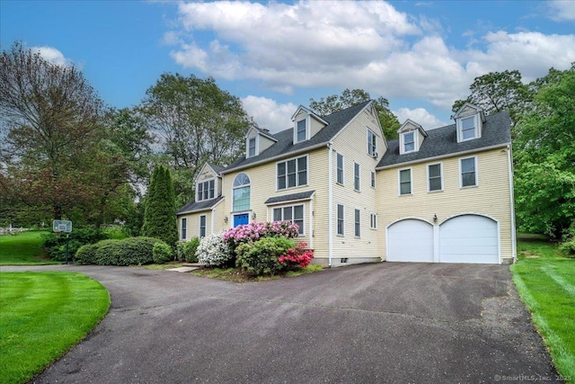 view of front of house featuring driveway and an attached garage