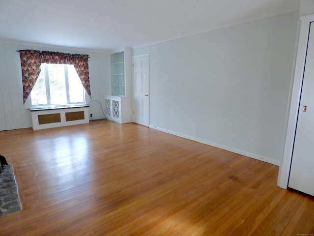 992 Ridge Rd, Wethersfield, CT 06109 - spare room featuring light wood-style floors and crown molding
