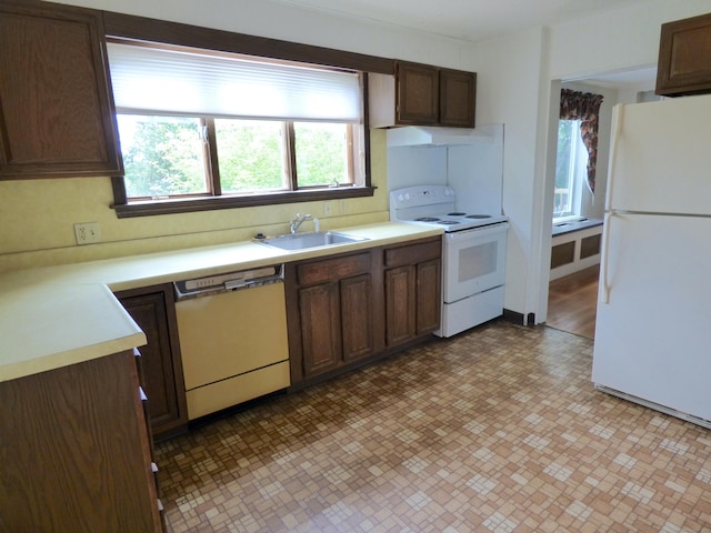 992 Ridge Rd, Wethersfield, CT 06109 - kitchen featuring white appliances, a sink, and light countertops