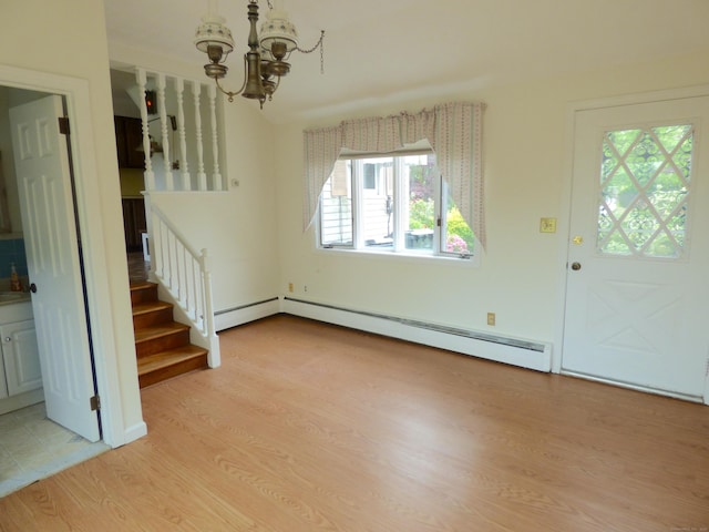 992 Ridge Rd, Wethersfield, CT 06109 - foyer with a chandelier, light wood-type flooring, stairs, a baseboard radiator, and baseboard heating