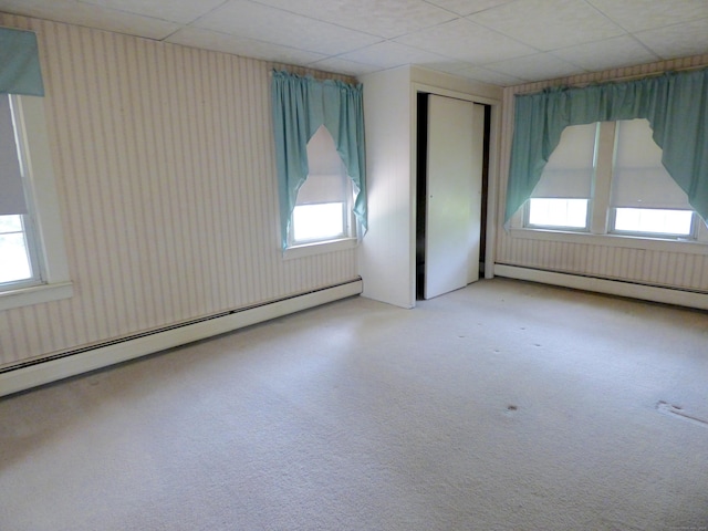 992 Ridge Rd, Wethersfield, CT 06109 - carpeted spare room with baseboard heating, plenty of natural light, and a paneled ceiling