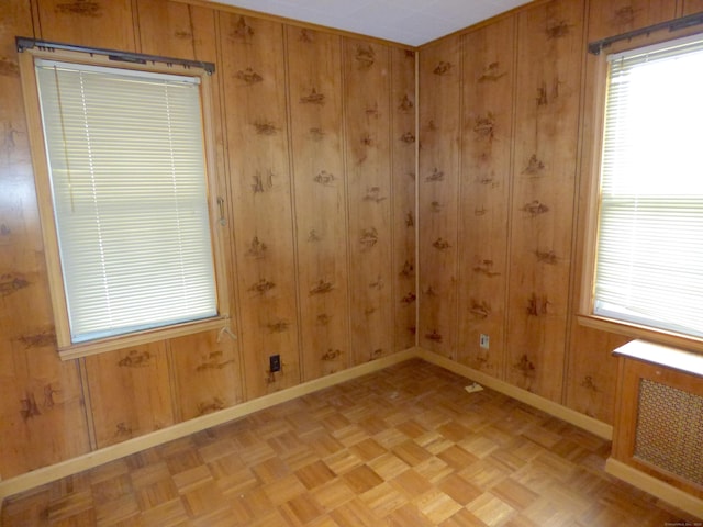 992 Ridge Rd, Wethersfield, CT 06109 - empty room featuring baseboards, healthy amount of natural light, and wooden walls