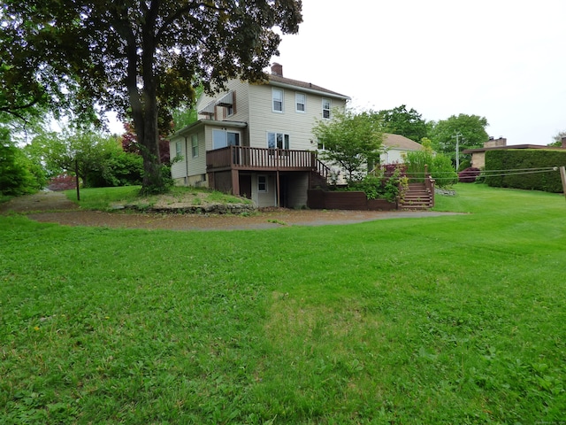 992 Ridge Rd, Wethersfield, CT 06109 - rear view of property featuring a deck, a yard, stairs, and a chimney