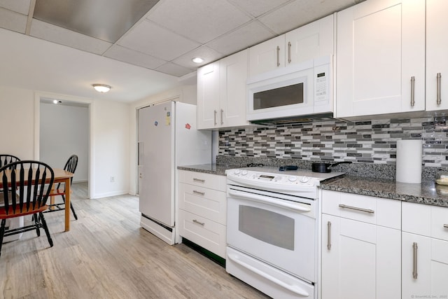53 Harwinton Ave Apt 1, Torrington, CT 06790 - kitchen with white appliances, light wood-style flooring, backsplash, dark stone countertops, and a paneled ceiling