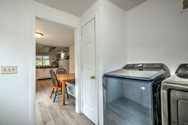 53 Harwinton Ave Apt 1, Torrington, CT 06790 - laundry room featuring washing machine and clothes dryer and wood finished floors