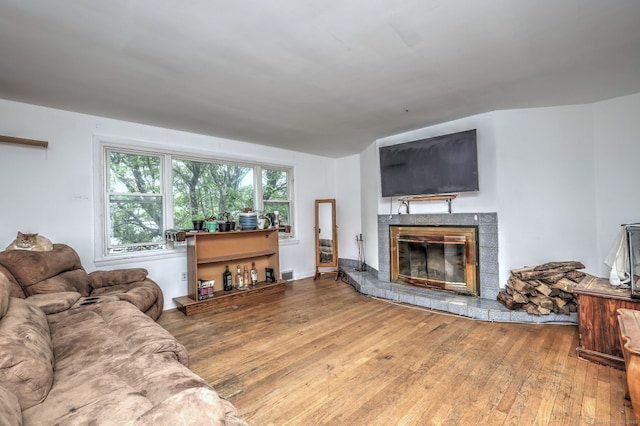 53 Harwinton Ave Apt 1, Torrington, CT 06790 - living area with hardwood / wood-style floors and a glass covered fireplace