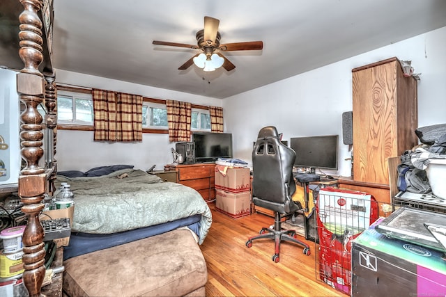 53 Harwinton Ave Apt 1, Torrington, CT 06790 - bedroom with light wood-style floors, an office area, and a ceiling fan