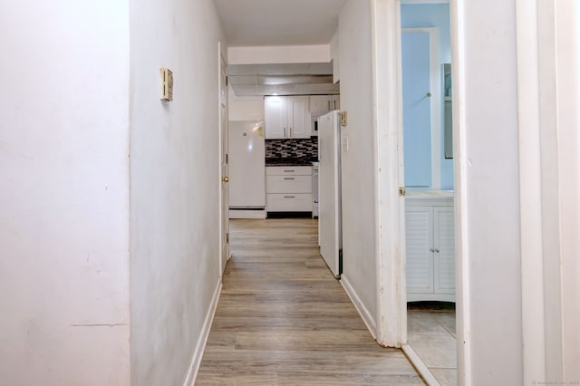 53 Harwinton Ave Apt 1, Torrington, CT 06790 - hallway with baseboard heating and light wood-style flooring