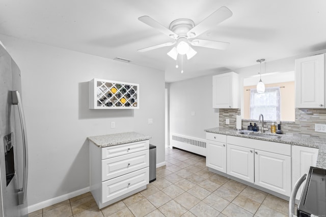 315 Prospect St, Wethersfield, CT 06109 - kitchen featuring radiator, a sink, range, tasteful backsplash, and ceiling fan
