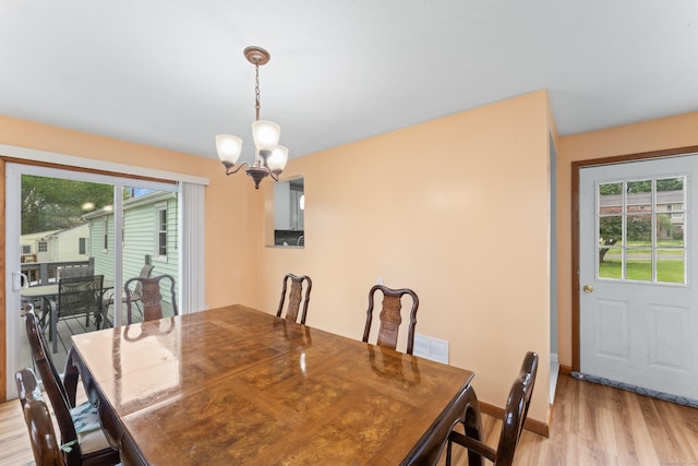 315 Prospect St, Wethersfield, CT 06109 - dining area featuring a chandelier, light wood-style flooring, plenty of natural light, and baseboards