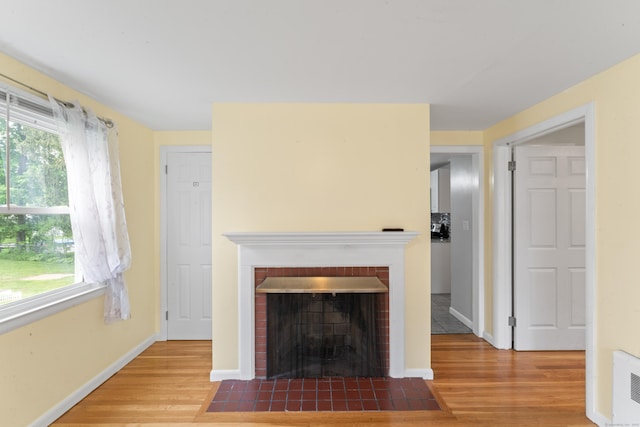 315 Prospect St, Wethersfield, CT 06109 - unfurnished living room with wood finished floors, healthy amount of natural light, and baseboards