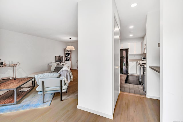 42 Temple Ct Unit 42, New Haven, CT 06511 - corridor featuring light wood-style flooring, an office area, and recessed lighting