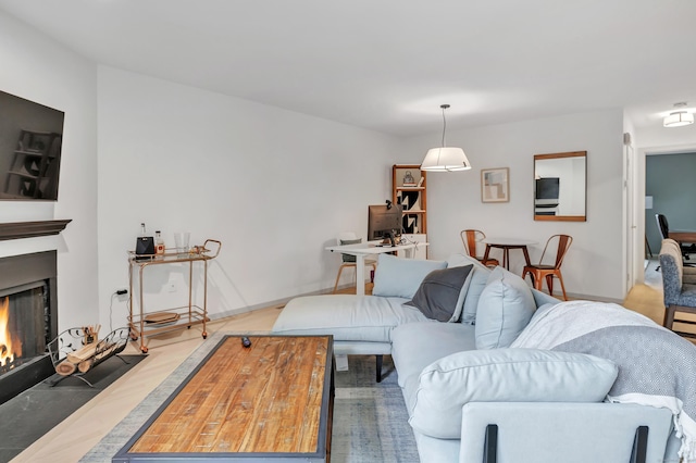 42 Temple Ct Unit 42, New Haven, CT 06511 - living room with a fireplace with flush hearth, baseboards, and wood finished floors