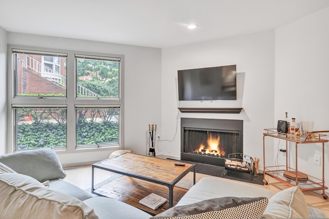 42 Temple Ct Unit 42, New Haven, CT 06511 - living room featuring a lit fireplace, recessed lighting, wood finished floors, and baseboards