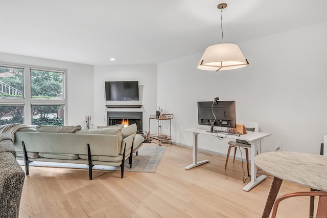 42 Temple Ct Unit 42, New Haven, CT 06511 - living area with light wood-type flooring, recessed lighting, a lit fireplace, and an office area
