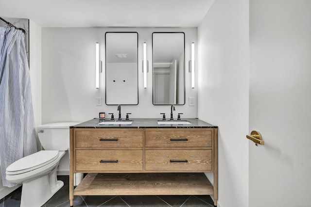 42 Temple Ct Unit 42, New Haven, CT 06511 - full bathroom with tile patterned floors, toilet, double vanity, and curtained shower