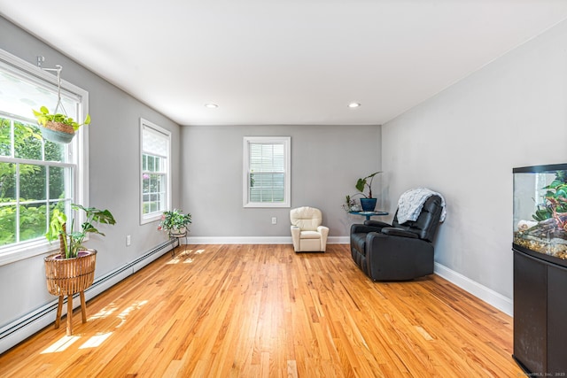 57 Harvard Ct, Middletown, CT 06457 - living area with light wood finished floors, a baseboard heating unit, baseboards, and recessed lighting