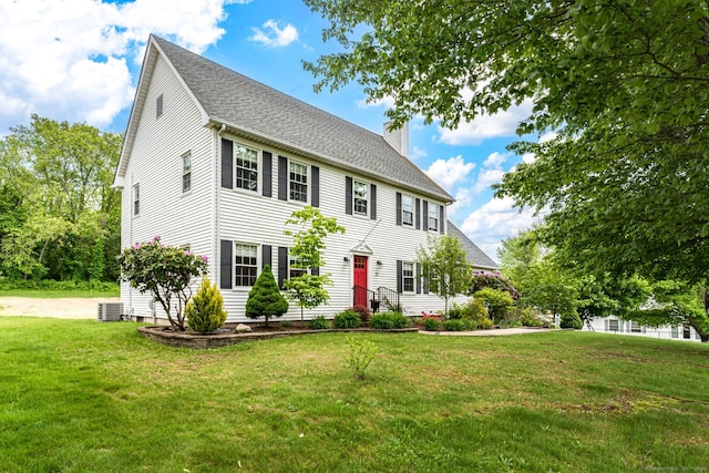 57 Harvard Ct, Middletown, CT 06457 - colonial house featuring a chimney, a front lawn, a shingled roof, and cooling unit