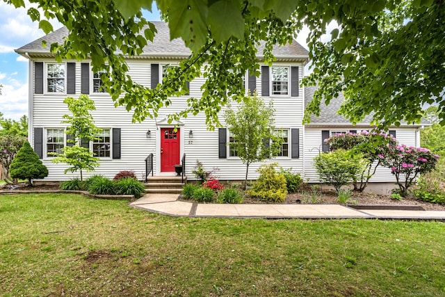 57 Harvard Ct, Middletown, CT 06457 - colonial-style house with a front yard and a shingled roof