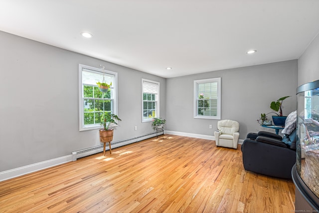 57 Harvard Ct, Middletown, CT 06457 - sitting room featuring a baseboard heating unit, light wood-style floors, recessed lighting, and baseboards