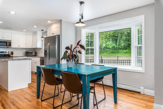 57 Harvard Ct, Middletown, CT 06457 - dining space with light wood finished floors, baseboards, recessed lighting, and a baseboard heating unit