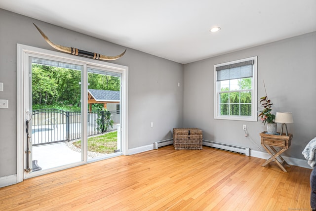 57 Harvard Ct, Middletown, CT 06457 - sitting room featuring a baseboard radiator, hardwood / wood-style floors, baseboards, and recessed lighting