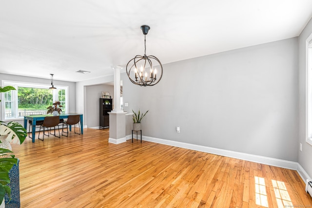 57 Harvard Ct, Middletown, CT 06457 - living area featuring light wood-style floors, baseboards, decorative columns, a chandelier, and baseboard heating