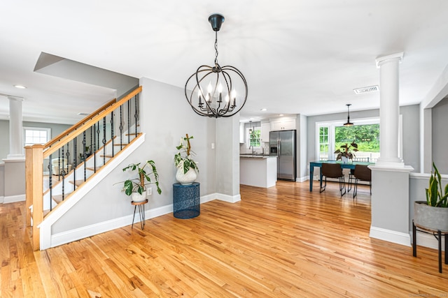 57 Harvard Ct, Middletown, CT 06457 - living room with decorative columns, light wood-type flooring, plenty of natural light, baseboards, and recessed lighting