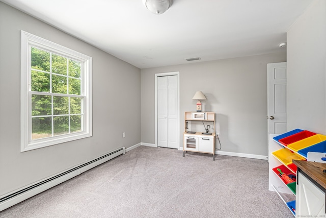 57 Harvard Ct, Middletown, CT 06457 - recreation room featuring a baseboard radiator, carpet floors, and baseboards
