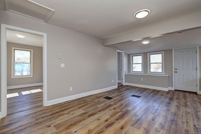 167 Gilbert St, West Haven, CT 06516 - unfurnished room with wood finished floors, healthy amount of natural light, baseboards, and lofted ceiling