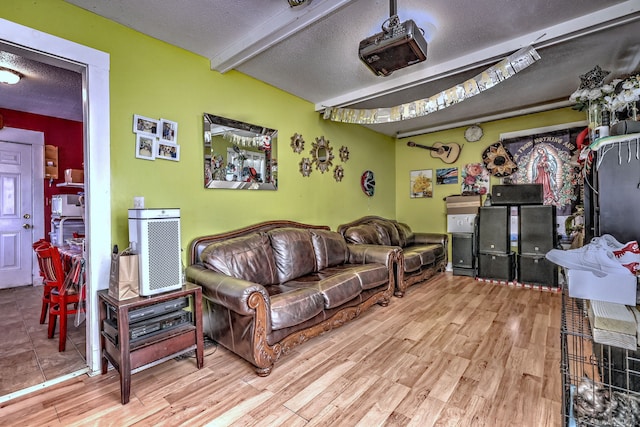167 Gilbert St, West Haven, CT 06516 - living room with a textured ceiling, beam ceiling, and wood finished floors