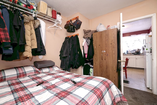 167 Gilbert St, West Haven, CT 06516 - bedroom with freestanding refrigerator and carpet floors