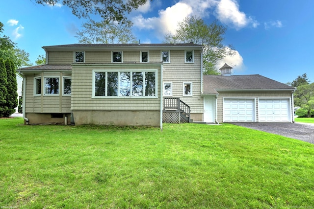 145 Casmir Dr, Fairfield, CT 06825 - rear view of house with a garage, driveway, and a lawn