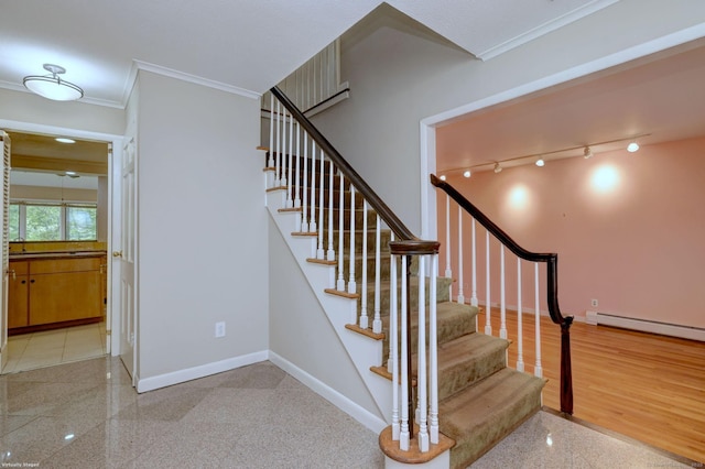 145 Casmir Dr, Fairfield, CT 06825 - staircase featuring ornamental molding, granite floors, baseboards, and a baseboard radiator