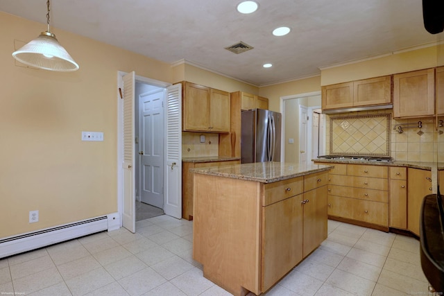 145 Casmir Dr, Fairfield, CT 06825 - kitchen with stainless steel appliances, a baseboard heating unit, a kitchen island, tasteful backsplash, and light stone counters