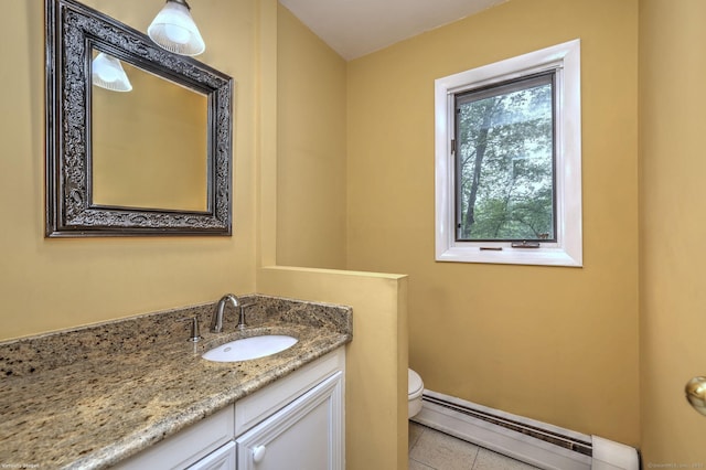 145 Casmir Dr, Fairfield, CT 06825 - bathroom with a baseboard heating unit, tile patterned floors, toilet, vanity, and baseboards