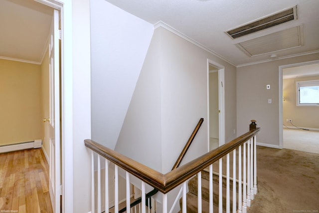 145 Casmir Dr, Fairfield, CT 06825 - hall featuring an upstairs landing, a baseboard heating unit, attic access, ornamental molding, and baseboards