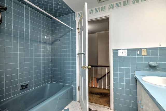 145 Casmir Dr, Fairfield, CT 06825 - bathroom with tile patterned flooring, tile walls, tub / shower combination, vanity, and wainscoting