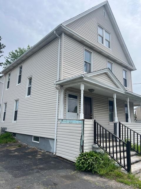 view of home's exterior with a porch